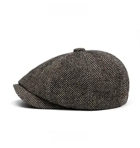 Side view of classic grey herringbone tweed newsboy cap with wool blend texture
