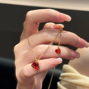 Elegant gold chain necklace with a red sparkling heart-shaped cubic zirconia pendant for women