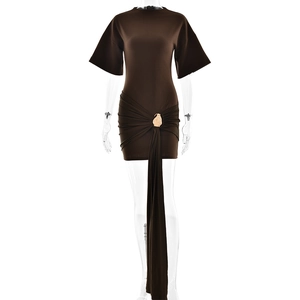 Detail of a brown ruched mini dress with a waist golden buckle and ribbon drape