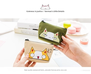 Detail of waterproof oxford cloth coin purses with cute cartoon cat patterns and zippers