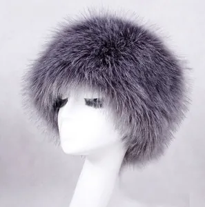 Detail of grey and white long faux fur winter hat texture and fluffy material on a model