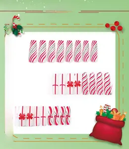 Macro view of long trapezoid Christmas nails with red bows and silver glitter accents