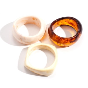 Three-piece bohemian resin bangle set with tortoiseshell and marble patterns in geometric shapes
