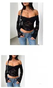 Détail de la dentelle florale sur un crop top noir à manches longues Y2K sexy