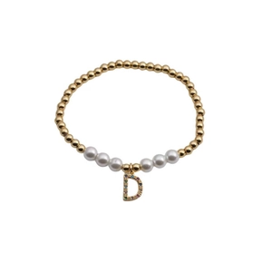 Detail of beaded bracelet with gold beads, pearls and colorful zircon letter D charm