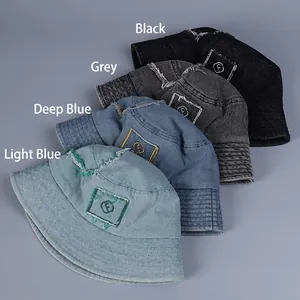 Distressed denim bucket hats with letter embroidery in light blue, dark blue, grey and black