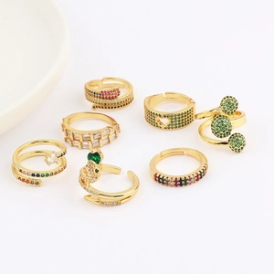 Golden rings set with colorful cubic zirconia in snake and heart shapes for women
