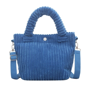 Royal blue corduroy bucket bag with plush handle and adjustable strap for women