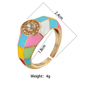 Detail of 18K gold plated ring featuring colorful enamel inlay and oval center zircon