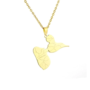 Macro shot of gold stainless steel Guadeloupe map pendant with engraved lettering details