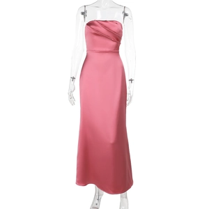 Detail of pink satin tube dress showing pleated bust design and silky fabric texture