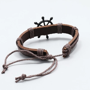 Vintage braided leather bracelet with black helm charm on a clean white background
