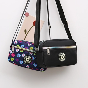 Waterproof nylon crossbody bags in black and floral patterns with sport logo