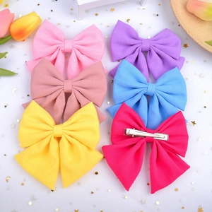 Set of large satin bow hair clips in vibrant candy colors with metal duckbill clips