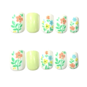 Short square press-on nails with floral hand-painted designs and pastel green accents