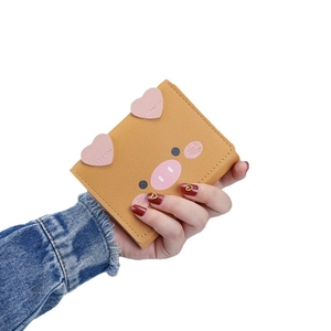 Cute cartoon pig short leather wallet for women with multiple card slots in yellow and brown