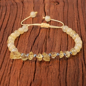 Adjustable natural citrine beaded bracelet with irregular stone chips on dark wood surface