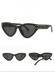 Detail view of black cat-eye sunglasses with gold accents shown from multiple angles