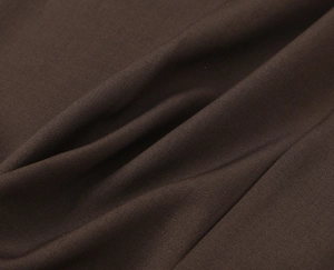 Close-up of deep brown twill weave fabric texture and high-quality textile details