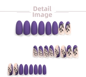 Detail of 24pcs purple matte press-on nails with gold glitter and black leaf patterns
