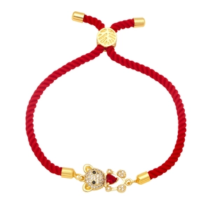 Cute red woven rope bracelet featuring a gold bear charm with sparkling heart stone