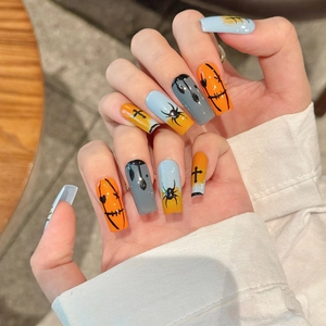 Halloween press-on nails with hand-painted spider and ghost face on colorful gradients