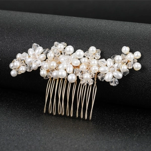 Handmade bridal hair comb with elegant white pearls and crystals on a gold base