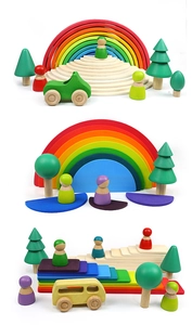 Detail of wooden rainbow arch set with peg dolls and toy vehicles for toddlers