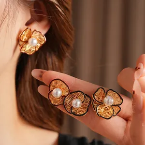 French vintage gold-plated flower stud earrings with white pearls and woven texture