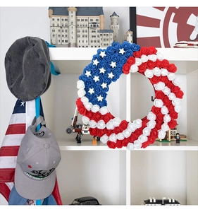 Detailed close-up of 4th of July wreath with red white and blue foam flowers and stars