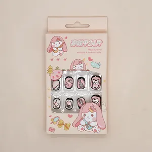 Pink rabbit press-on nails set featuring cute paw prints and star patterns for kids