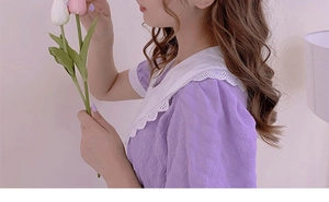 Close-up of lavender textured plaid top with large white lace-trimmed collar