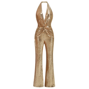 Close-up of champagne gold sequined fabric with halter neck and twisted waist detail