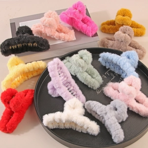 Plush faux fur claw clips in multiple vibrant colors for thick hair winter styling