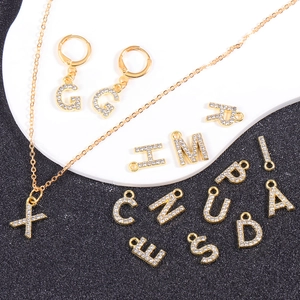 Gold plated rhinestone alphabet necklace and earring set featuring crystal 26 letter charms