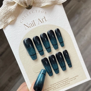 Dark blue gradient cat-eye press-on nails with glitter and black line in long coffin shape