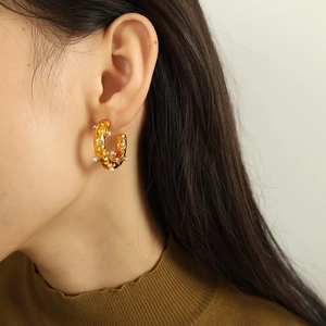 Vintage 18K gold plated C-shaped hoop earrings with rhinestones on model