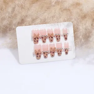 Unghie finte con stampa leopardata, fiocco e strass, forma ballerina lunga elegante