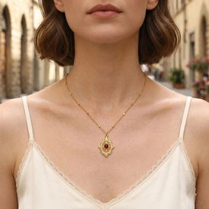 Vintage 18K gold plated beaded necklace with ruby pendant and filigree detailing