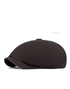 Detailed view of grey cotton newsboy hat showing fine fabric texture and stitching