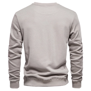 Detail of light grey cotton sweatshirt back view showing ribbed hem and sleeve cuffs