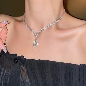 Luxury silver-tone waterdrop pendant necklace featuring shimmering crystal pavé details