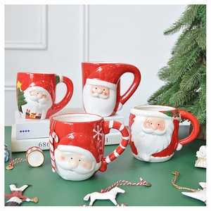 Detailed close-up of 3D embossed Santa Claus ceramic mugs with festive holiday decor