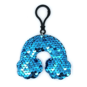 Close-up of blue sequined rainbow keychain pendant with black plastic clip and metal ring