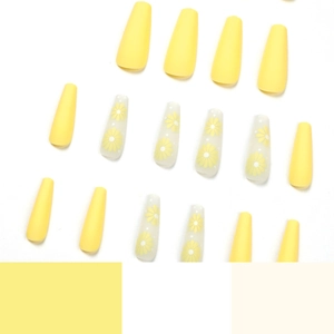 Matte yellow coffin press-on nails with daisy floral designs in a vibrant set