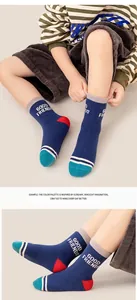 Detail of colorful cotton crew socks for kids with side letter print and knit texture