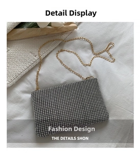 Close-up of sparkling silver rhinestone evening bag with elegant golden chain strap