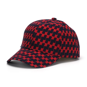 Close-up of red and black checkered plaid baseball cap with classic geometric pixel pattern