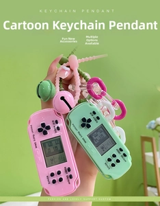 Close-up of pink and green Tetris game console keychains with colorful silicone straps