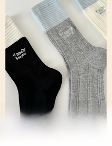 Detail of knit socks with contrast cuffs and Bebe Bonjour letter embroidery